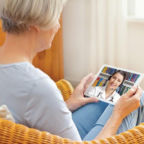 Lady on an iPad talking to a doctor